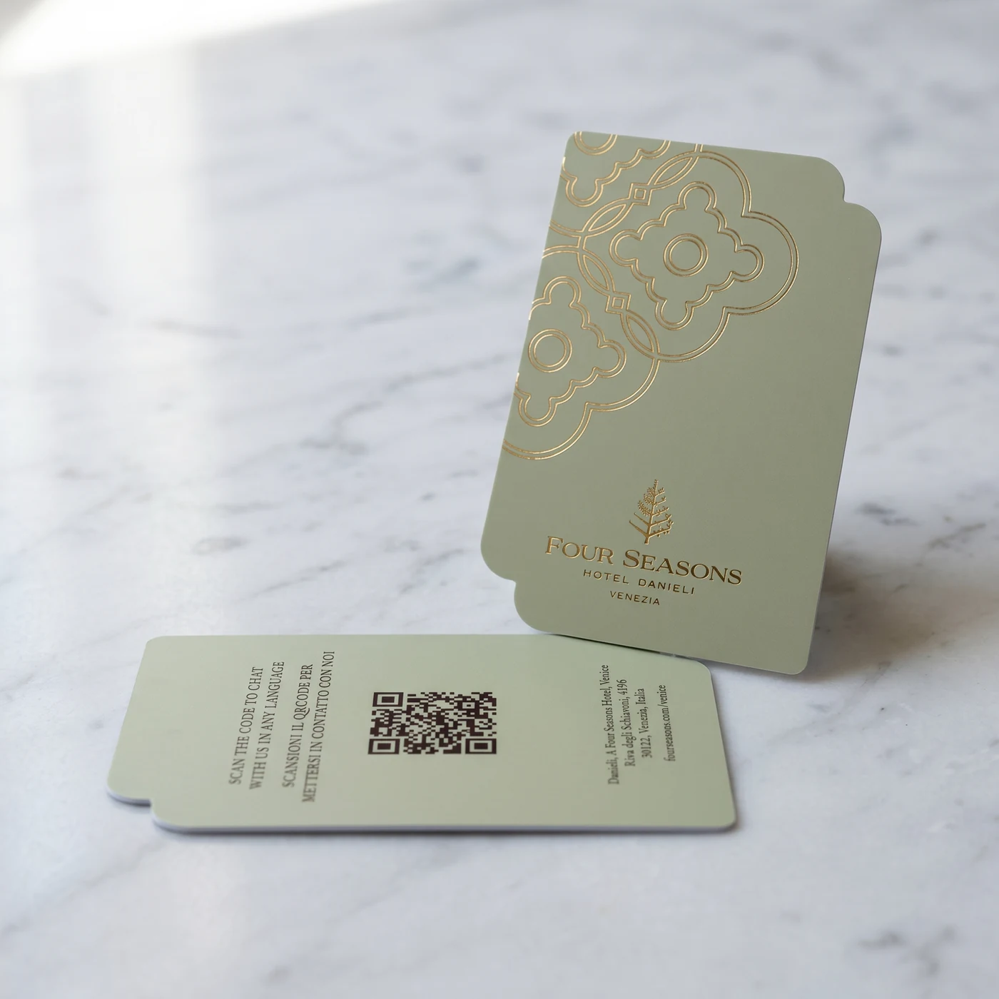Four Seasons Hotel Danieli Venice sage green key card on Carrara marble with gold foil branding
