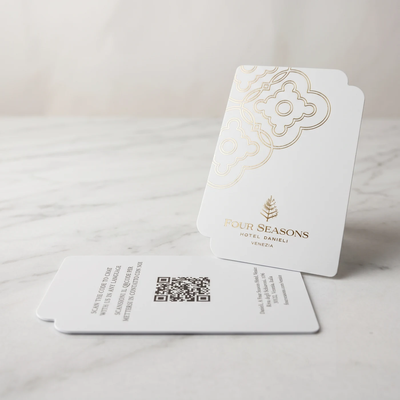 Four Seasons Hotel Danieli Venice white RFID key card with gold foil Venetian quatrefoil pattern on Carrara marble
